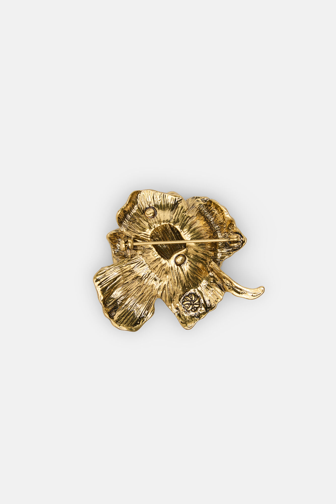 Hoss Intropia Liso. Broche de flor banhado a ouro